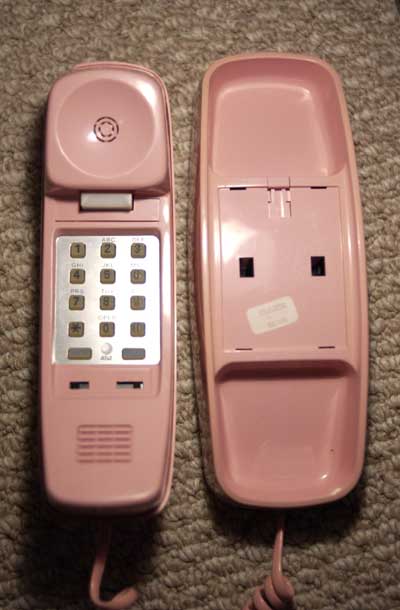 Pink AT&T Trimline telephone from 1986 resting on carpet